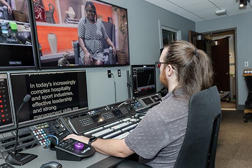 Person sitting in a television control room